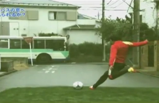 Set-piece specialist Shunsuke Nakamura aims a free-kick at a moving bus