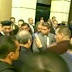 حصرى حبيب العادلى يخرج من المحكمة وهو يضحك بعد برائته والضباط يؤدون له التحية العسكرية