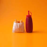 ketchup fries Photo by Miguel Andrade on Unsplash