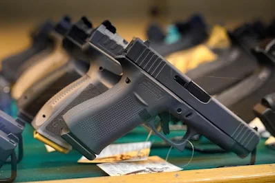 Gun owners who were prosecuted under D.C. laws that have since been struck down can receive money in a class-action settlement announced Monday. (Robert F. Bukaty/AP)