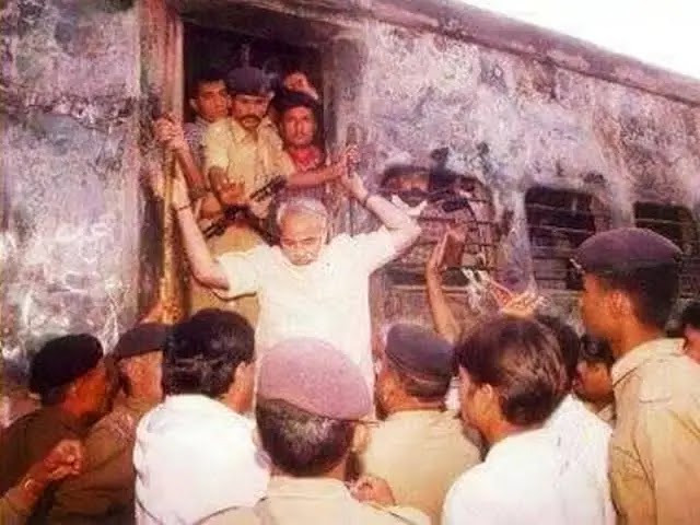 Modiji at the charred remains of 59 karsevaks, women & children coming from Ayodhya burnt alive in Godhra.