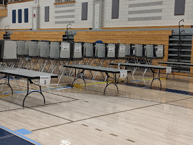 precinct tables are quiet after 8:00 PM when the polls have closed