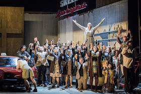 Opera North’s production of Mascagni’s Cavalleria rusticana, Autumn 2017 Katie Bray as Lola, Phillip Rhodes as Alfio and Giselle Allen as Santuzza with the Chorus of Opera North (Photo Robert Workman)