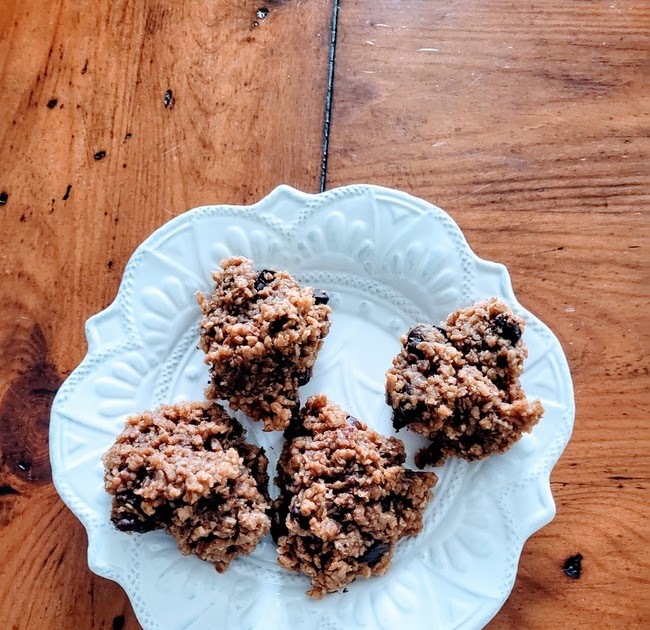 Peanut butter oatmeal cookie plated on wood dining room table 