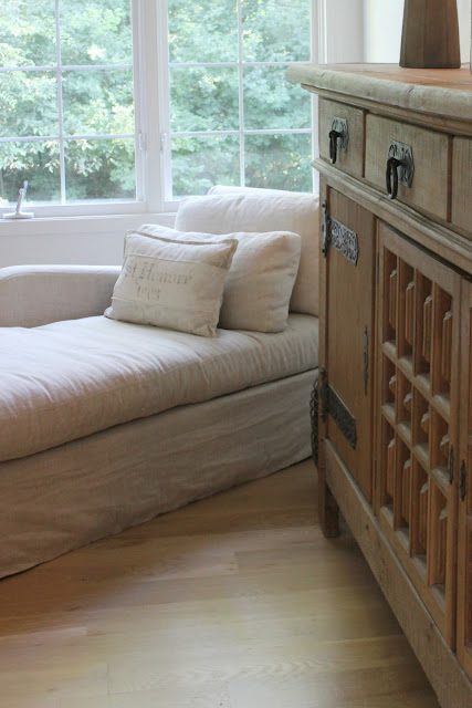 Rustic oak Belgian antique cupboard in European country styled living room by Hello Lovely Studio