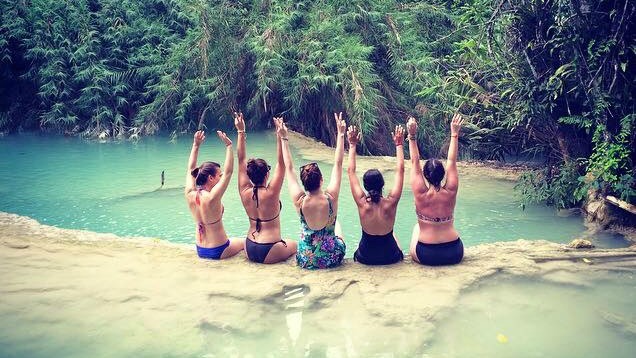 Girls in front of waterfall