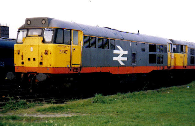 photo of uk diesel locomotive class 31187 in railfreight livery on sidings at whitemoor yard cambridgeshire 1989