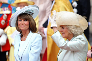 Carole Middleton smiles as Camilla, Duchess of Cornwall waves to the cheering crowds following the ceremony.