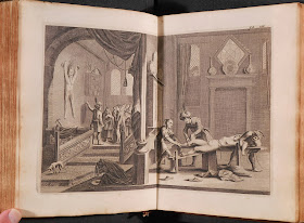 An illustration showing the pinned skin on the lefthand page, while on the right a nude woman is being tied down.