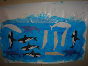 . using construction paper and glued them to the ocean background. (dsc )