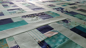 Detour quilt in aqua and navy from Stash Statement quilting book by Kelly Young