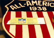 An Ice Bowl (1967 NFL championship) ticket stub on a giant AllAmerican logo .