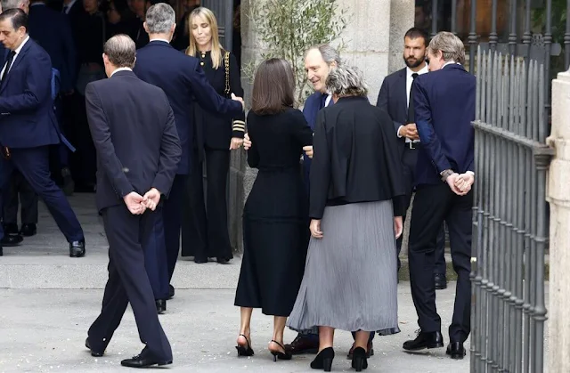 Queen Letizia wore a black tweed dress and pearl diamond brooch. King Felipe attended Fernando Gomez Acebo's funeral