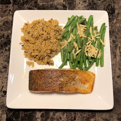 Crispy skin salmon done mid-rare, wild rice and haricots verts almondine