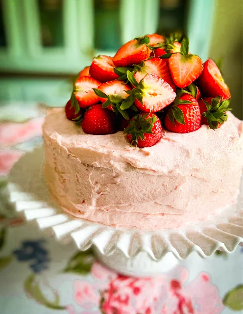 Fresh Strawberry Cake with Strawberry Buttercream Frosting, the ultimate Southern dessert for any special occasion, or just for a delightful dinner with family.  Fresh juicy strawberries take center stage in this show-stopping strawberry cake and buttercream frosting.