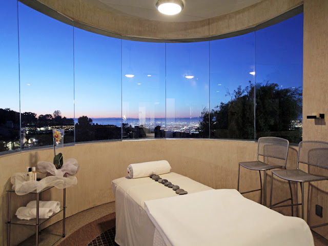 Photo of massage room with massage table and incredible views of Los Angeles