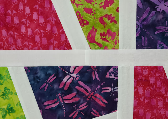 Split 4 Patch baby quilt in Romance Garden fabrics | DevotedQuilter.com