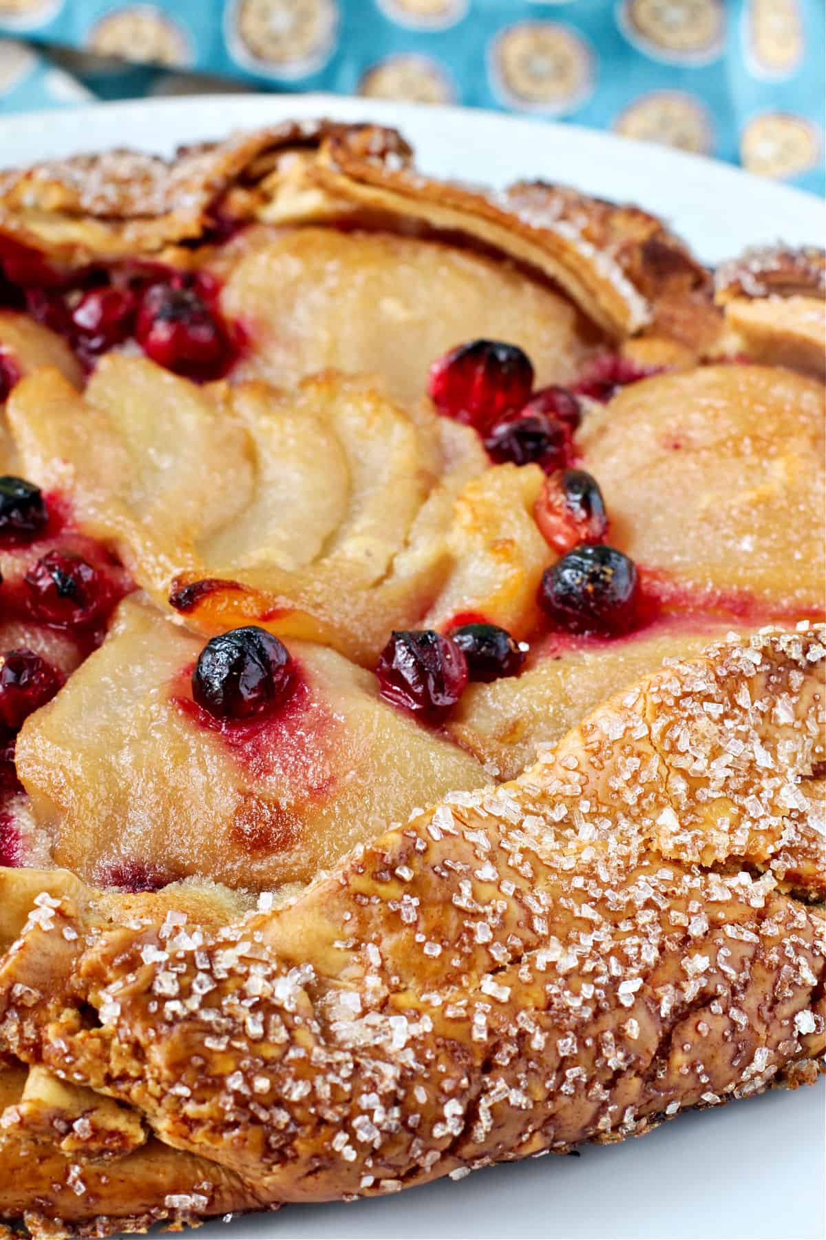 Close up of roasted pear tart with cranberries.