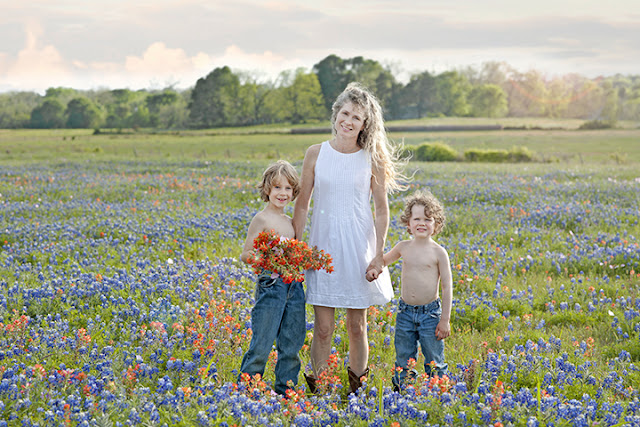 family in bluebonnet field