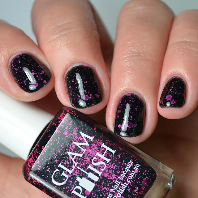 black nail polish with pink glitter four finger swatch