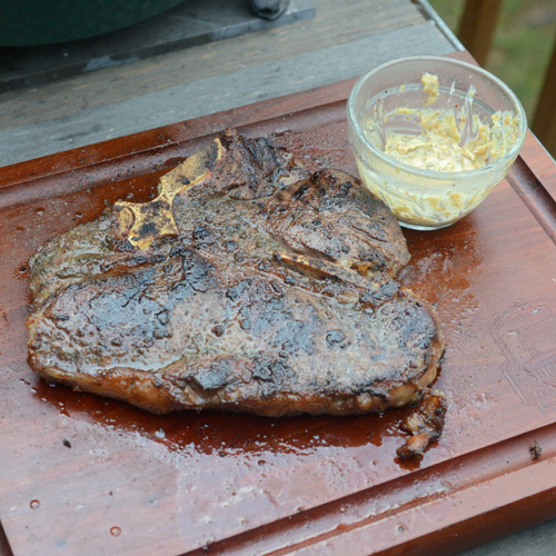 Grilled porterhouse steak with green pepper butter