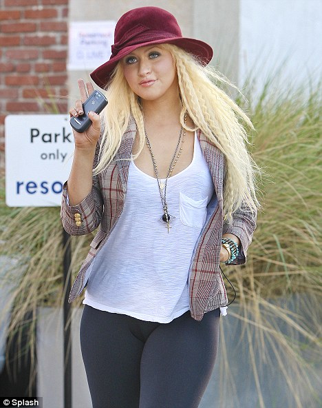 Please leg-go! Christina Aguilera digs out her favourite skin-tight leggings and they STILL don't do her any favours