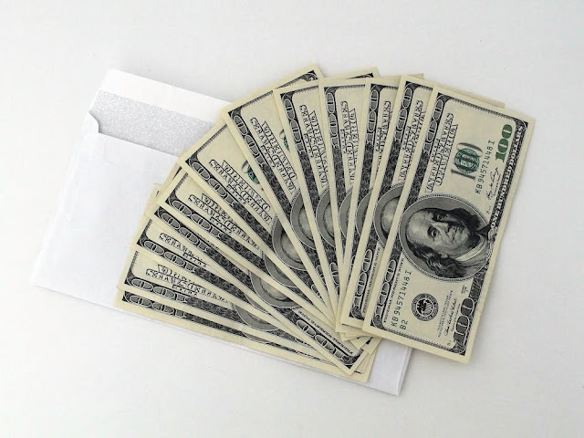 Hundred-dollar banknotes in a fan