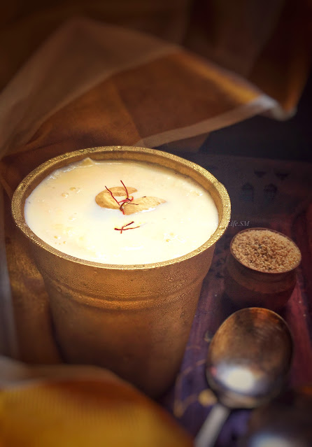 "A glass of Gase Gase Payasam garnished with roasted cashew nuts and saffron - A heavenly dessert from Karnataka, India."