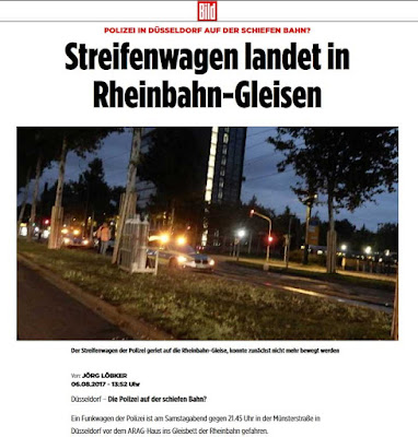 http://m.bild.de/regional/duesseldorf/polizei-streifenwagen/streifenwagen-landet-in-gleisen-52780954.bildMobile.html