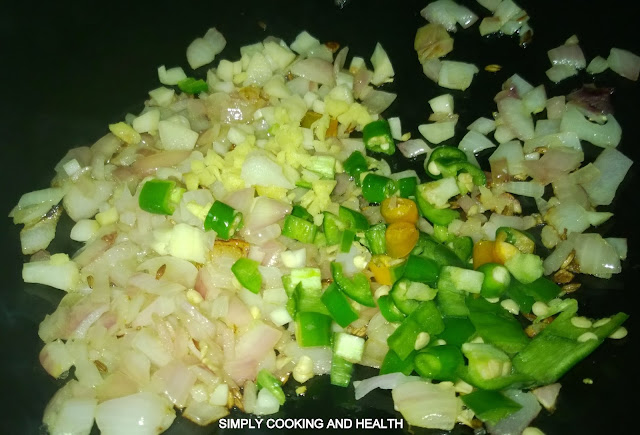 Adding chili, garlic ginger and bell pepper