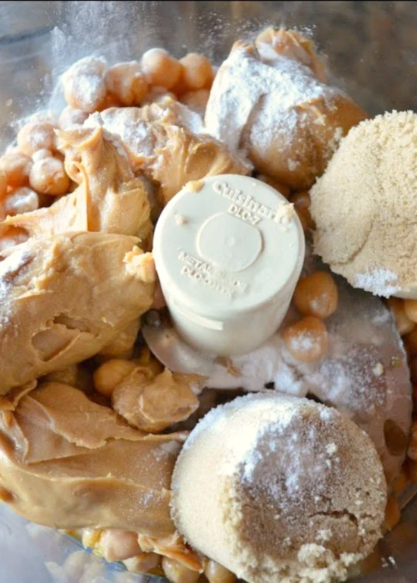 Add to chickpeas peanut butter, sugar, baking powder, vanilla and salt.
