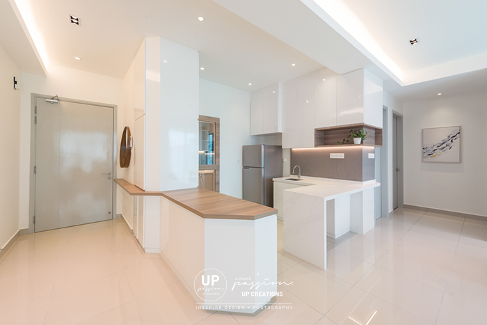 The vyne condo entrance foyer with wood top cabinet as a divider from kitchen