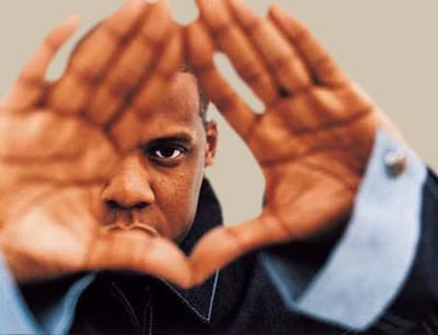 JAY-Z with his diamond signal apparently because he associates himself with 