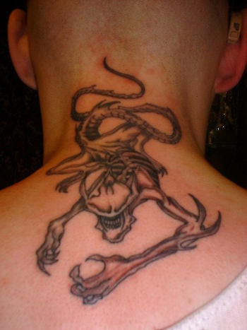 Classic aliens tattoo pictures are often described as big headed creature