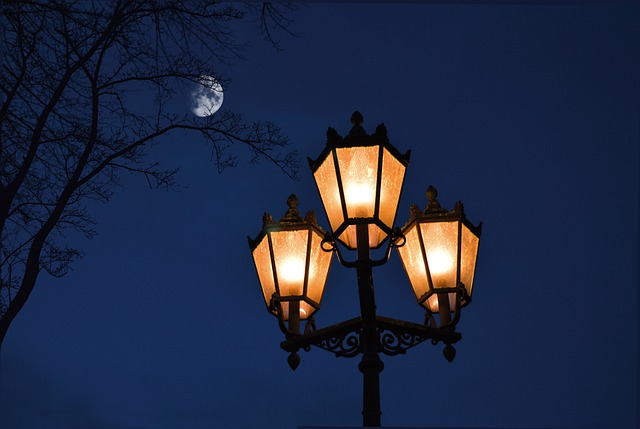 streetlight beneath the moon