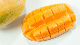 scored mango into chunks