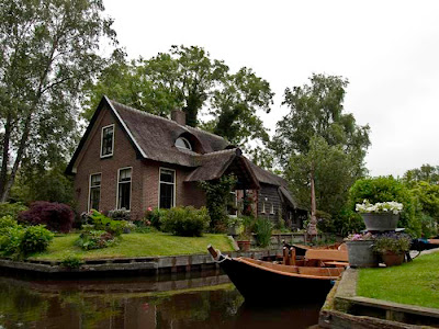 Can you imagine a village with no roads? There is such a place in the Netherlands called Giethoorn (pronounced 'geethorn'). There are no roads and cars have to remain outside the village. The only access to the stunningly lovely houses in Giethoorn is by water, or on foot over tiny individual wooden bridges.