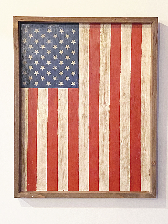 American flag hanging in wooden frame