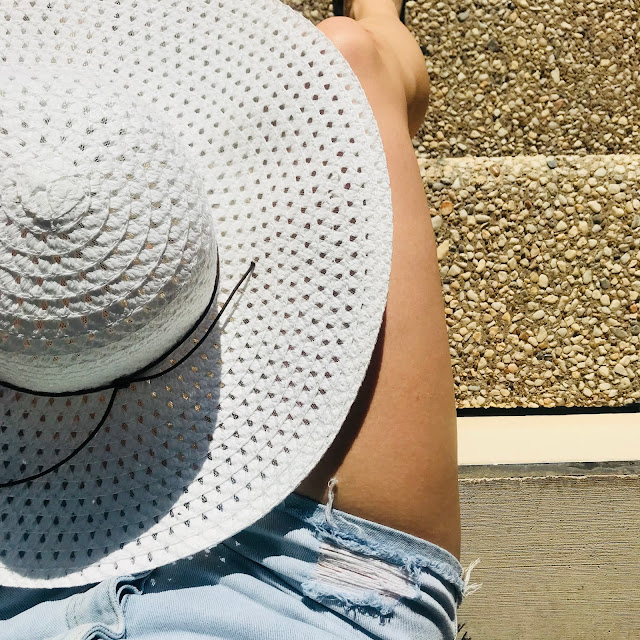 Giant white floppy hat from Walmart to wear on labor day