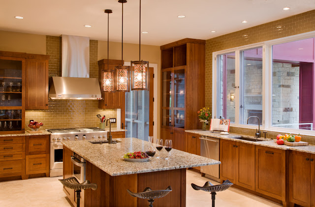 Picture of large modern kitchen with brown furniture and kitchen island in the middle
