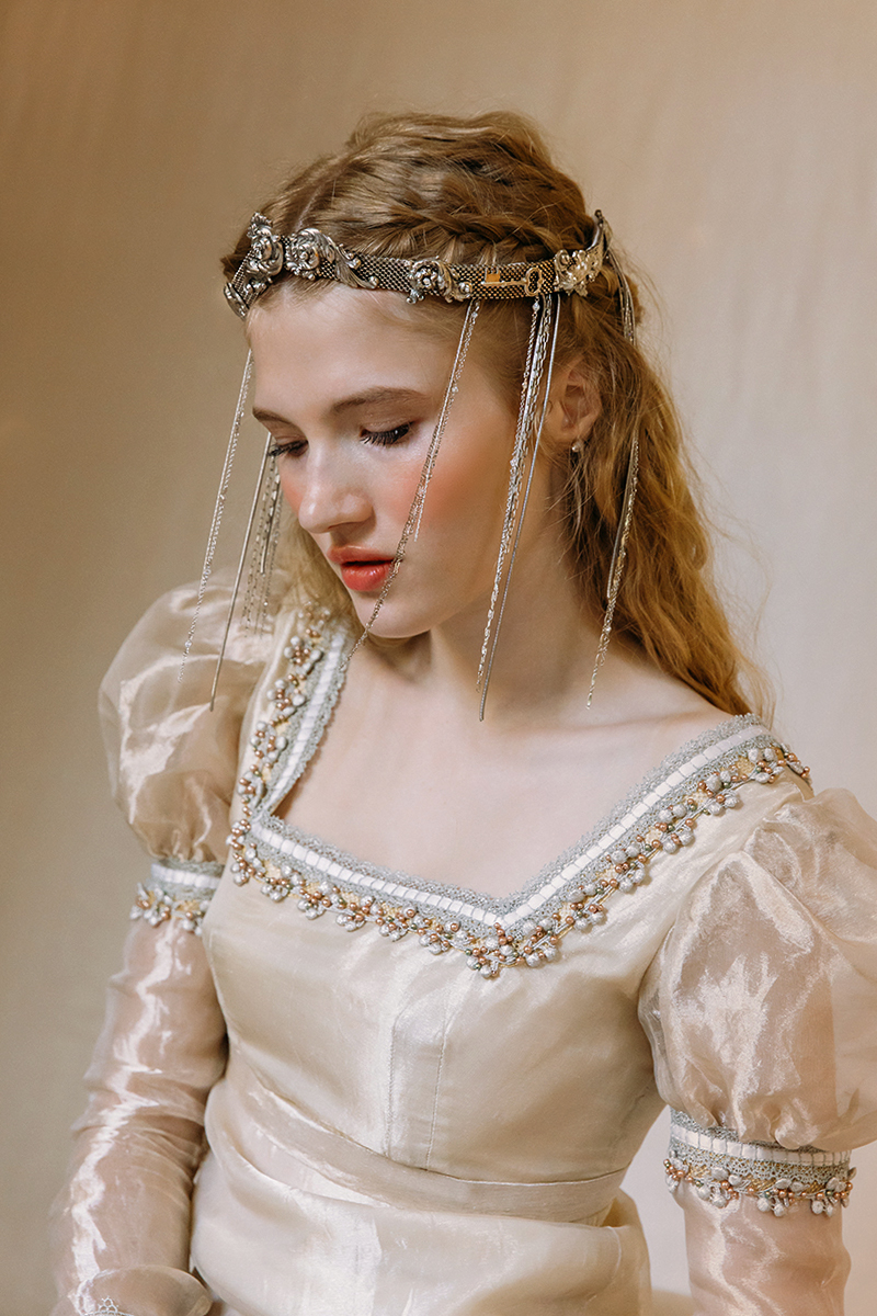 medieval bride with tiara on her head and long ginger hair