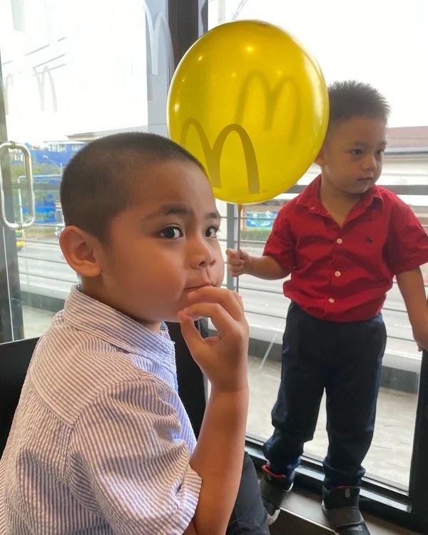 Miguel and Rafa in their first Christmas party at McDonald's Belfast