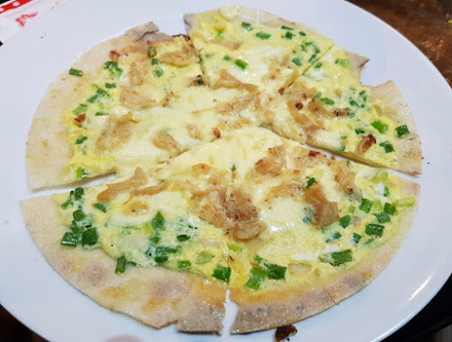 A Banh Trang Nuong tuna pizza from Container Kafe 2, Tan Dinh Ward