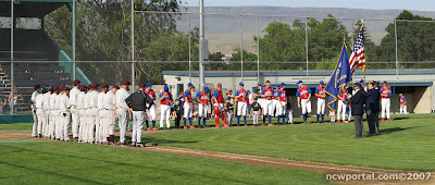 At attention during the National Anthem