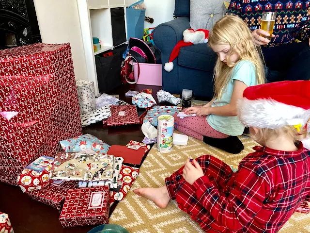 My daughter's opening their Christmas presents