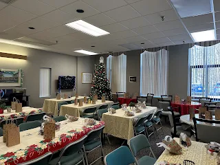Lincoln School Apartments community room with holiday decorations