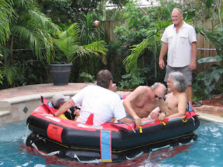 John Kretschmer supervises a life raft launch in a swimming pool