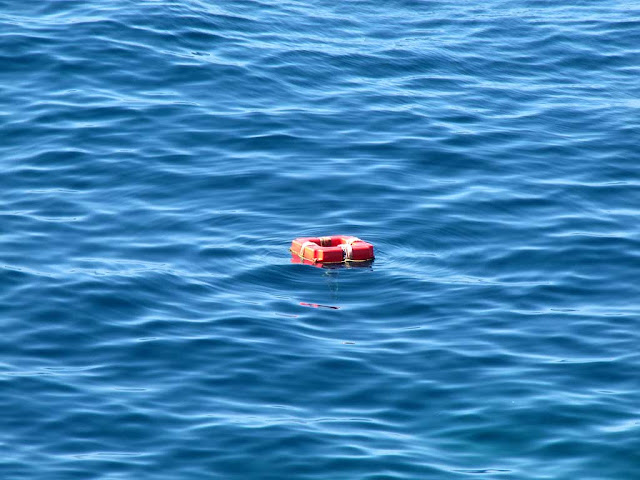 Lifebuoys in the sea, Romito, Livorno