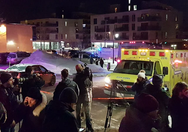 Image Attribute: An ambulance is parked at the scene of a fatal shooting at the Quebec Islamic Cultural Centre in Quebec City, Canada January 29, 2017. REUTERS/Mathieu Belanger