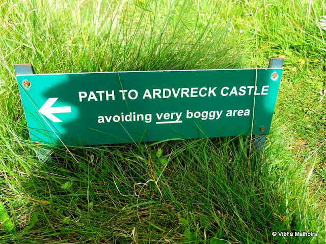 On the banks of Loch Assynt, a lake in the North-East Highlands of Scotland, are two ruins. Both of them are in advanced stages of decay and have very interesting stories linked with them.First of them is the Calda House, which was constructed in the 18th century by the members of the Clan Mackenzie. The house once used to be a three storied abode that burnt down after a lightning strike apparently because the occupants continued to celebrate on the Sabbath day of the Lord. Looking at the state of the house today, one would guess the age of the building to be much more than only a couple of centuries.This is how the Calda House would've looked when it was still inhabited and not burnt down. Look at the detailed maps. Each floor has at least 6 rooms. Sometimes it is difficult to perceive how something as big as a house can be annihilated by a local fire. Hmm. Anyways, the house is allegedly haunted by several ghosts now. I was just imagining how the area would look after the day lights faded. There were no apparent arrangements for artificial lighting. A sight of the creepy, lonely house standing miles away from any human population is enough to scare anyone. Ghosts are just garnishing.This was where our little bus was parked as well. As you can see, there's not a soul in sight for miles. Sheep don't count. And there are no bright street lights that we expect from a road.And this was how the more famous of the two ruins, the Ardvreck Castle was supposed to look like when it was not in ruins. This building is a little older than the Calda house and is very much in ruins itself as you will see in a few moments. The castle is now a risky building with the masonary ready to jump out at you at the slightest provocation. So care is advised if you visit this monument.  And this was the path we were advised to take. The path wasn't VERY boggy but it was boggy nevertheless. A bog is a wetland that contains peat that is formed by the remains of dead plants. peat is a very important fuel in these regions. The Castle was stationed on a low rocky hill next to the lake. The slippery terrain and the rocks below make this a very difficult picture to take. I think I was a little foolish to attempt this picture. Don't follow my example please. The area doesn't need any more resident ghosts. Here is the first view of the legendary Ardvreack Castle built by the members of Clan Macleod in the 16th century. The structure is imposing even in decay. This was apparently built with the support of the devil and, in exchange, one of the daughters of the Macleods was to marry the Devil. Devastated, the maiden flung herself out of a window of the castle. Her ghost is supposed to haunt the ruins till date. In front our some canoes that provided a good perspective to the picture.This is a small inlet of the Loch Assynt jutting into the castle grounds right next to the magnificient ruins. The water was clean yet grey because of the poor lighting.A view of the seemingly placid Lake Assynt from a hill on its bank. Some of the white dots in the distance are sheep grazing.A sample of what the view from the castle's windows would've been like. I wonder how people who lived in such beautiful surroundings could be so cruel to each other. Scotland's history is so full of anger, violence, hatered, and betrayal, that it isn't surprising that so many Ghosts continue to haunt these regions.My friend Andy from Taiwan clicking a risky picture.  And in the distance, visible through the window are some of our tour companions. Me and Andy were often the last ones to get back to the bus. But we were definitely a disciplined batch because we still made it in time. The canoes are finally out on the Lake. The temperatures were quite low so I bow to the courage and passion of these sailors.And here is the castle up close. Quite imposing, isn't it?